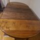 Round walnut table in solid wood, Napoleon III style with extensions - for 14 settings.