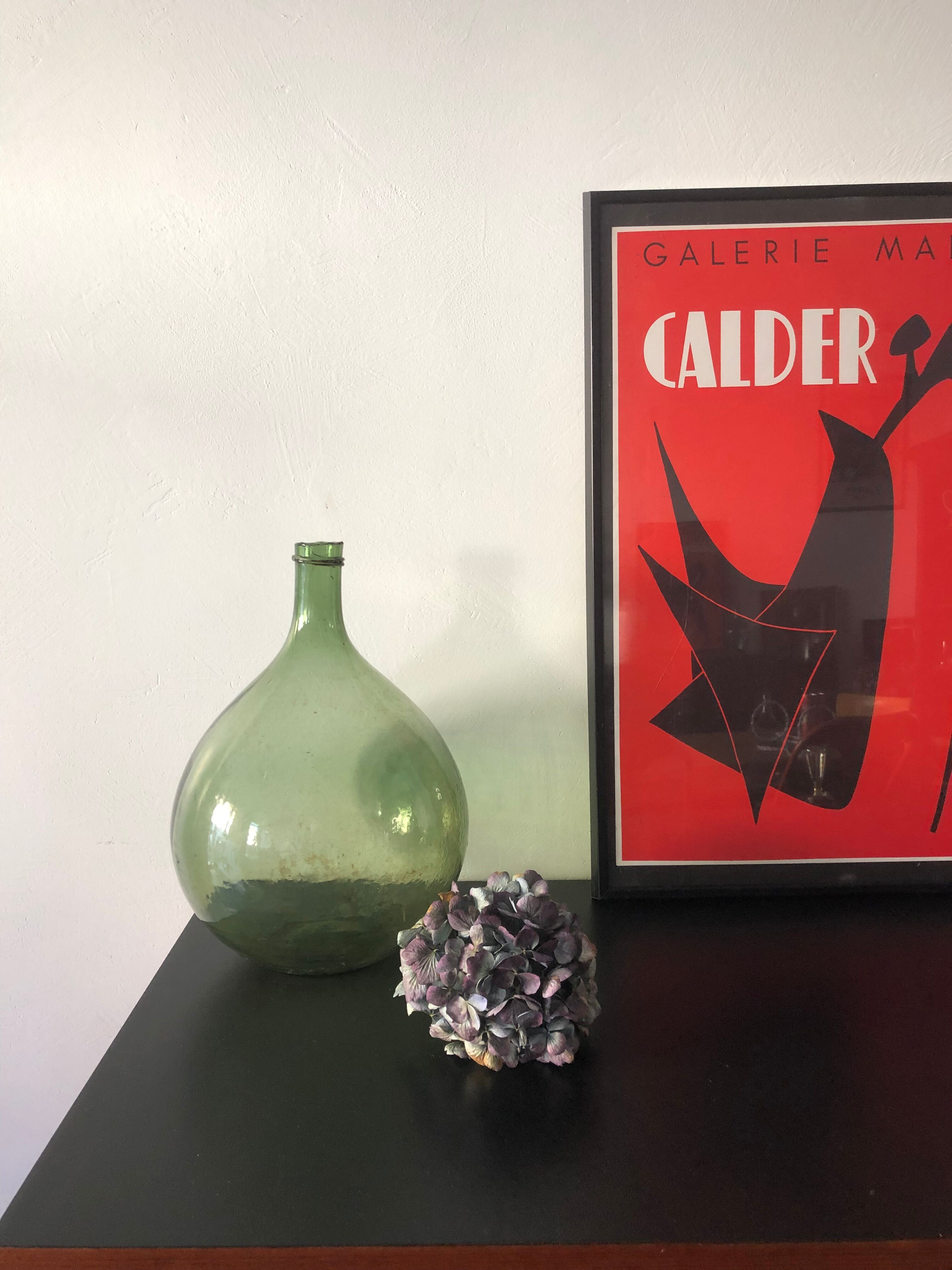 Demijohn old bottle in blown glass