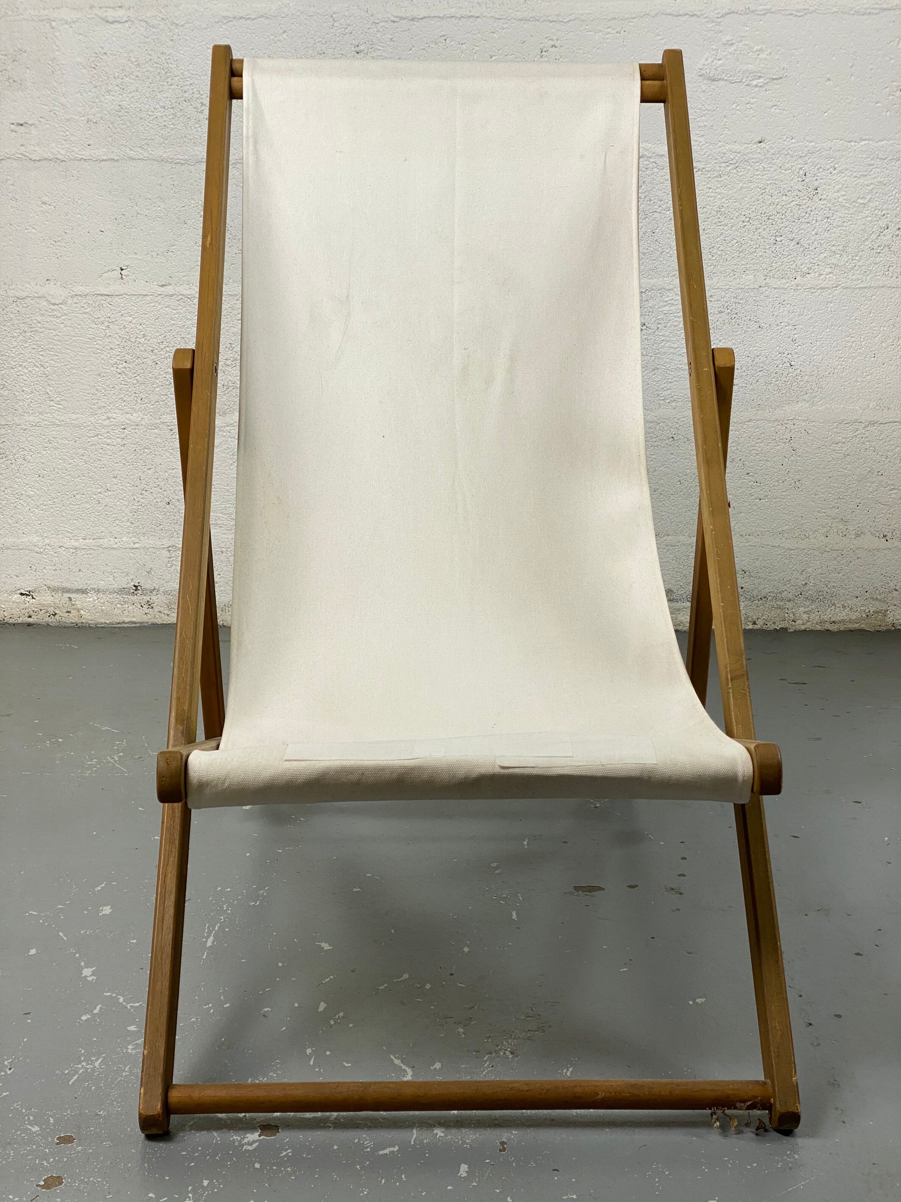 White fabric deckchair with wooden structure