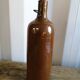 Ancienne bouteille en grès vernissé art populaire vintage