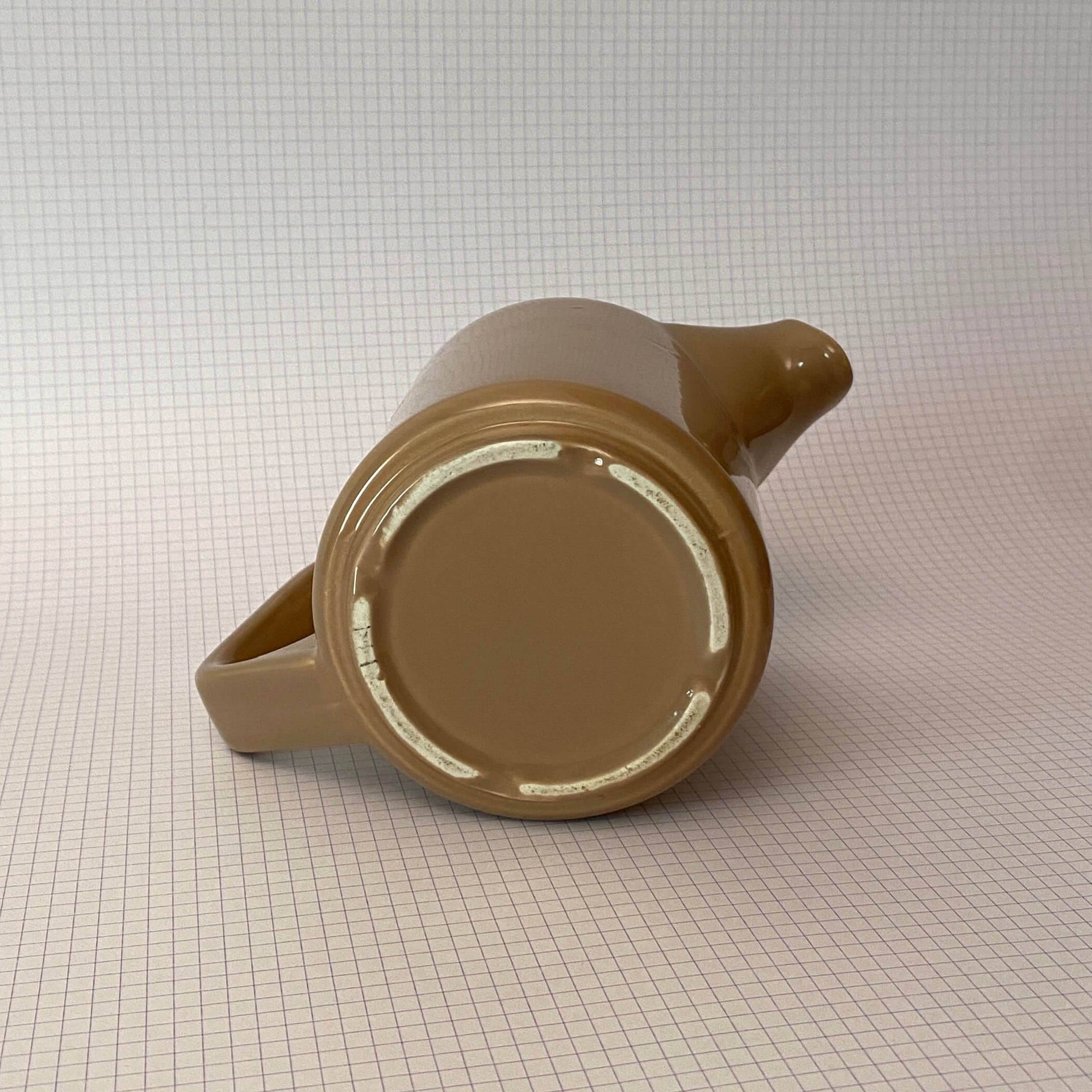 Brown ceramic pitcher