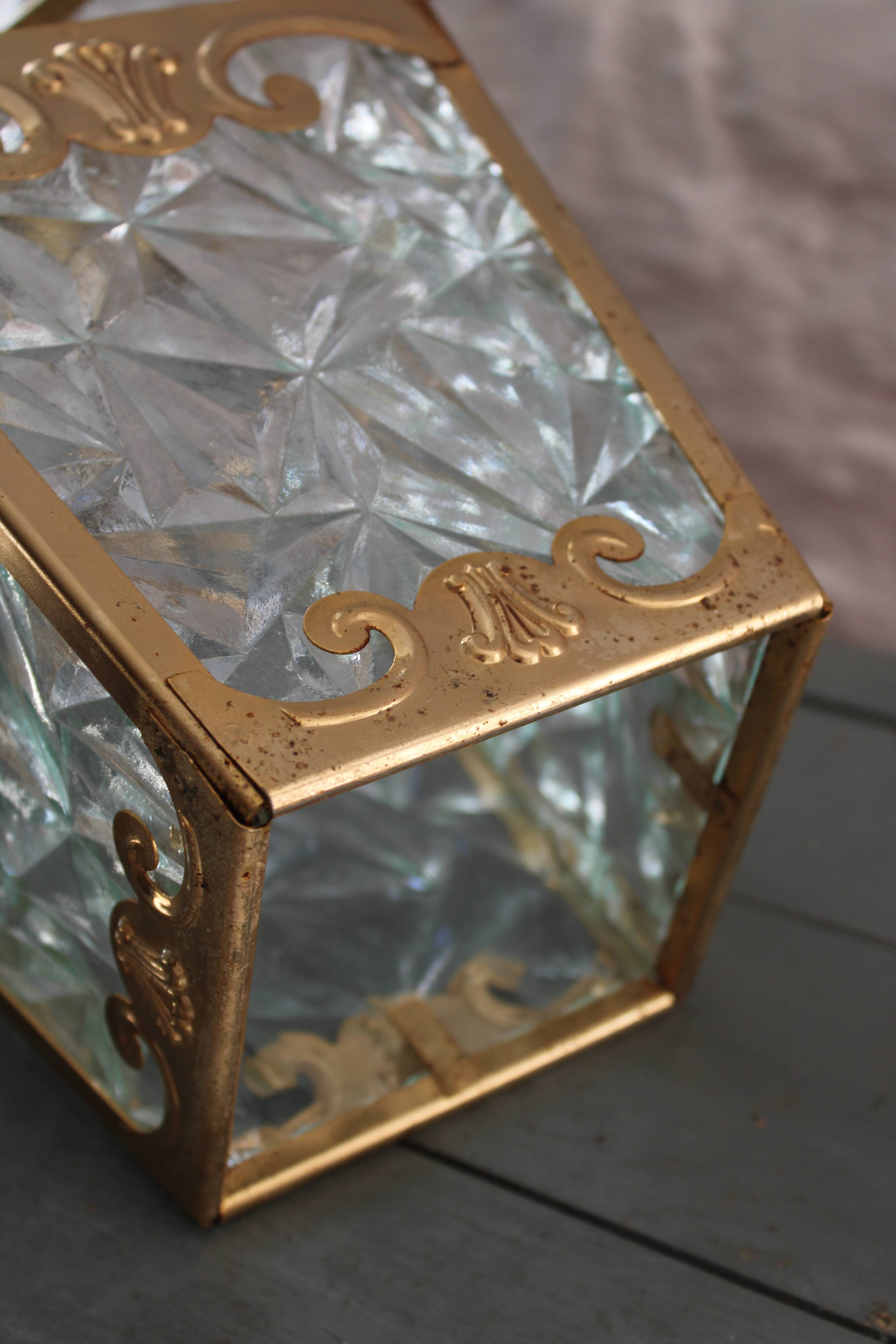 Glass and brass suspension