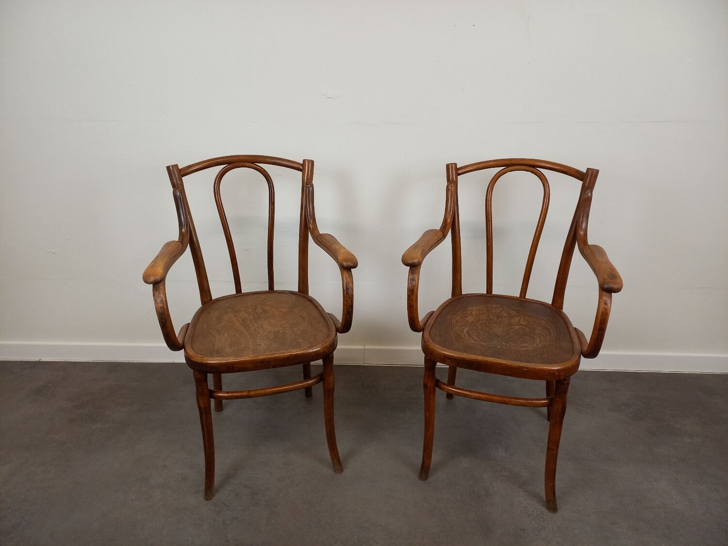 Pair of curved wooden bistro armchairs