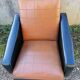 Paire de fauteuils en simili cuir