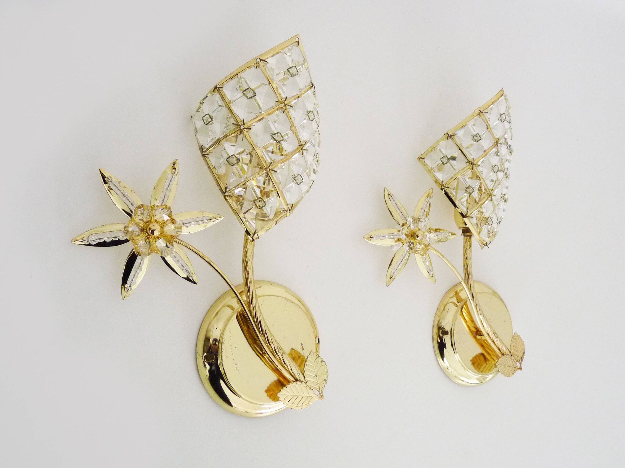 Pair of vintage floral wall sconces in gold metal and tassel