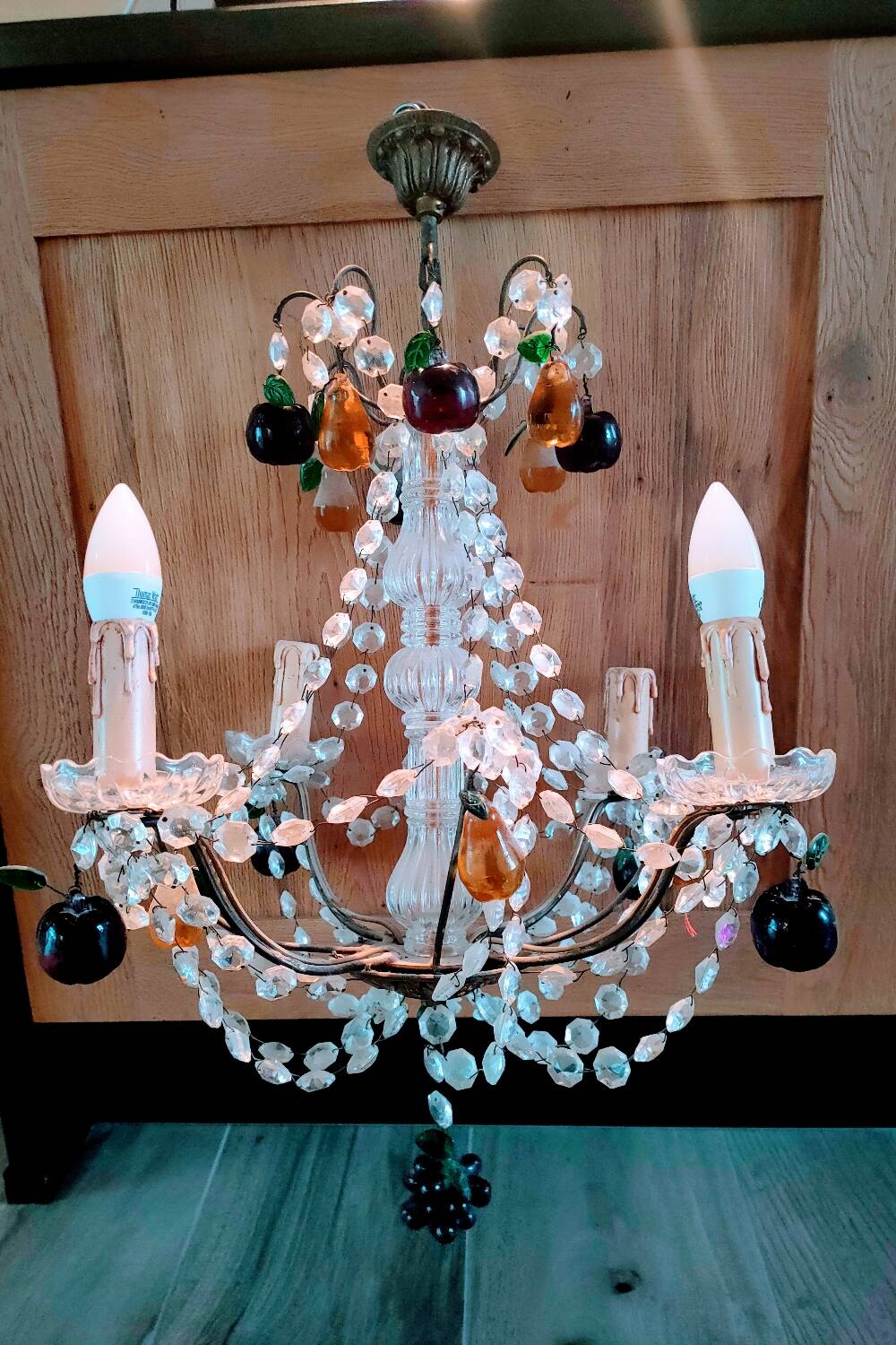 Golden bronze chandelier with fruit pendants