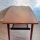 Danish 1960s teak coffee table with slatted shelf.