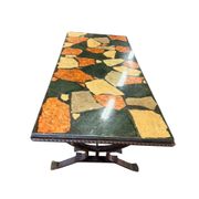 Vintage stone coffee table with a cast iron frame.