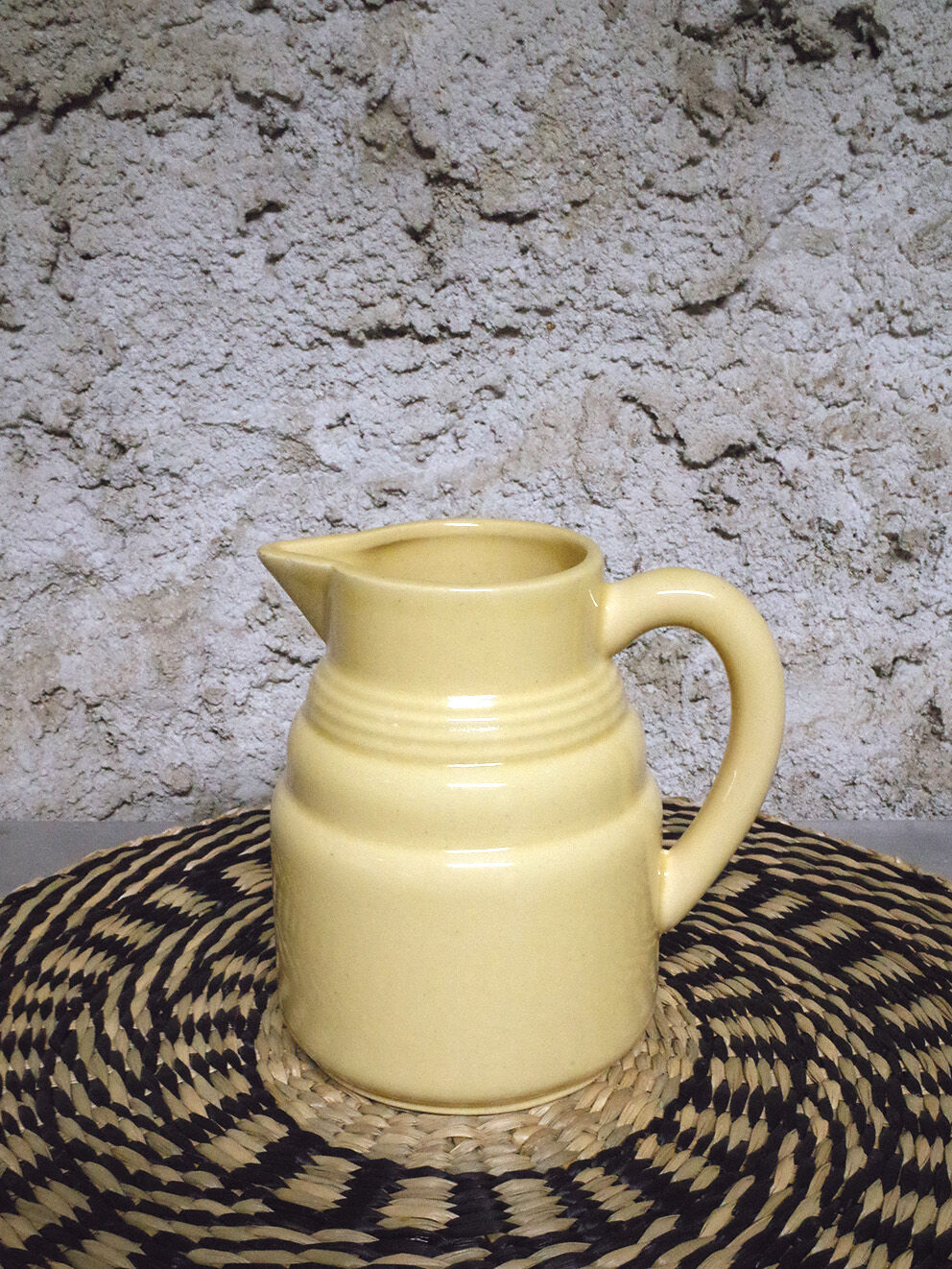 Pastel yellow ceramic pitcher