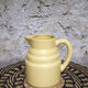 Pastel yellow ceramic pitcher