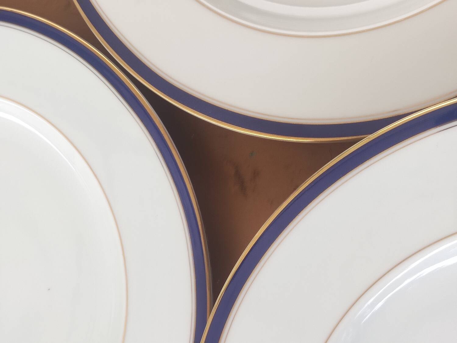 Six blue and gold Limoges porcelain dinner plates