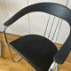 Space Age chairs in black leather and chrome metal