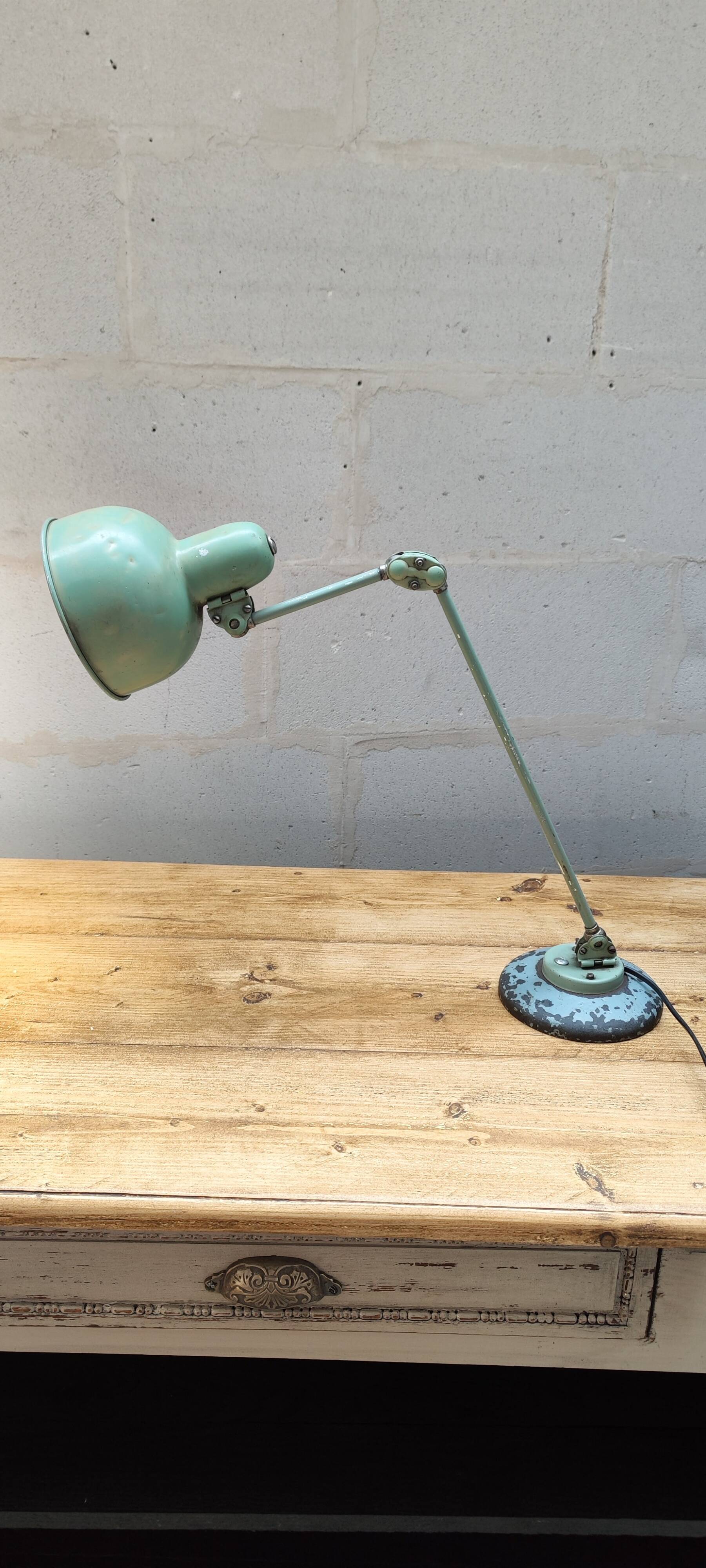 Old green industrial desk lamp