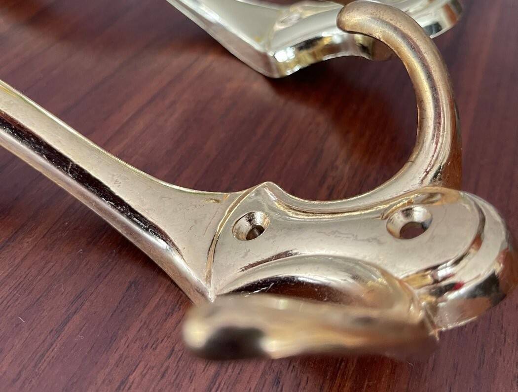 4 golden brass coat racks