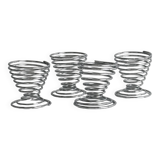 Set of 4 designer egg cups in shiny silver metal