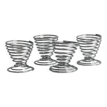 Set of 4 designer egg cups in shiny silver metal