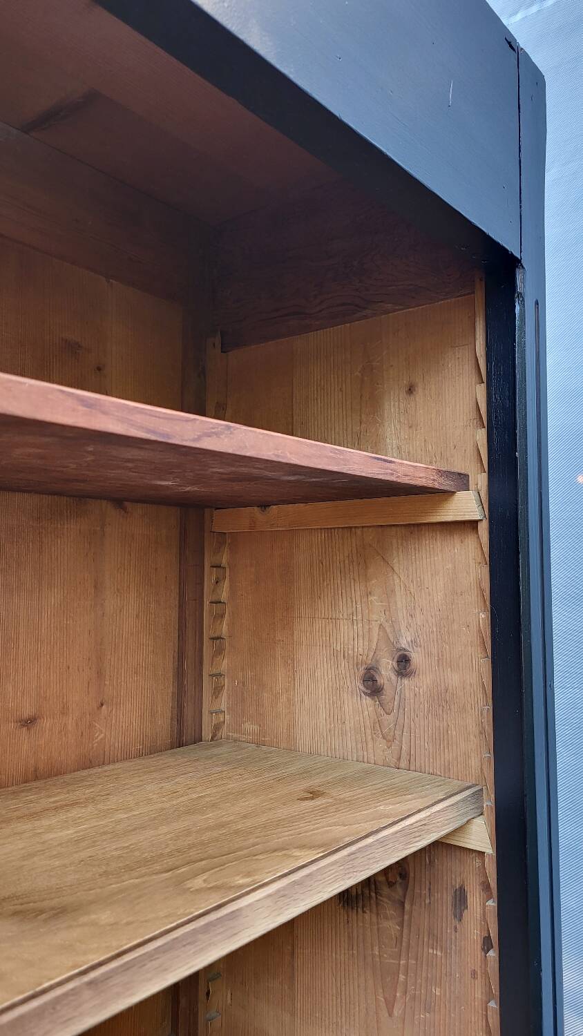 Two-tone black and honey bookcase