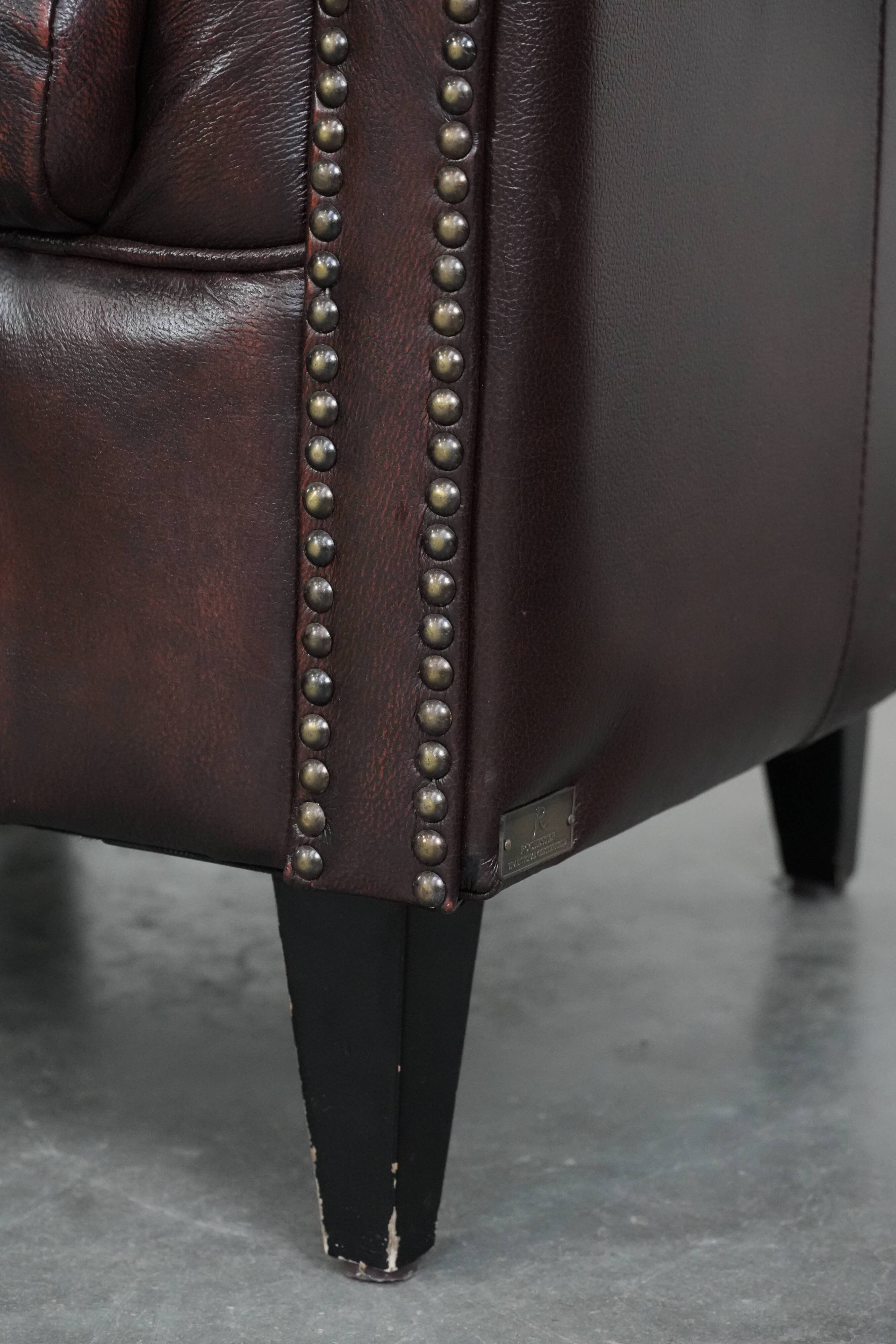 Set of three classic English-style Chesterfield cowhide  club armchairs