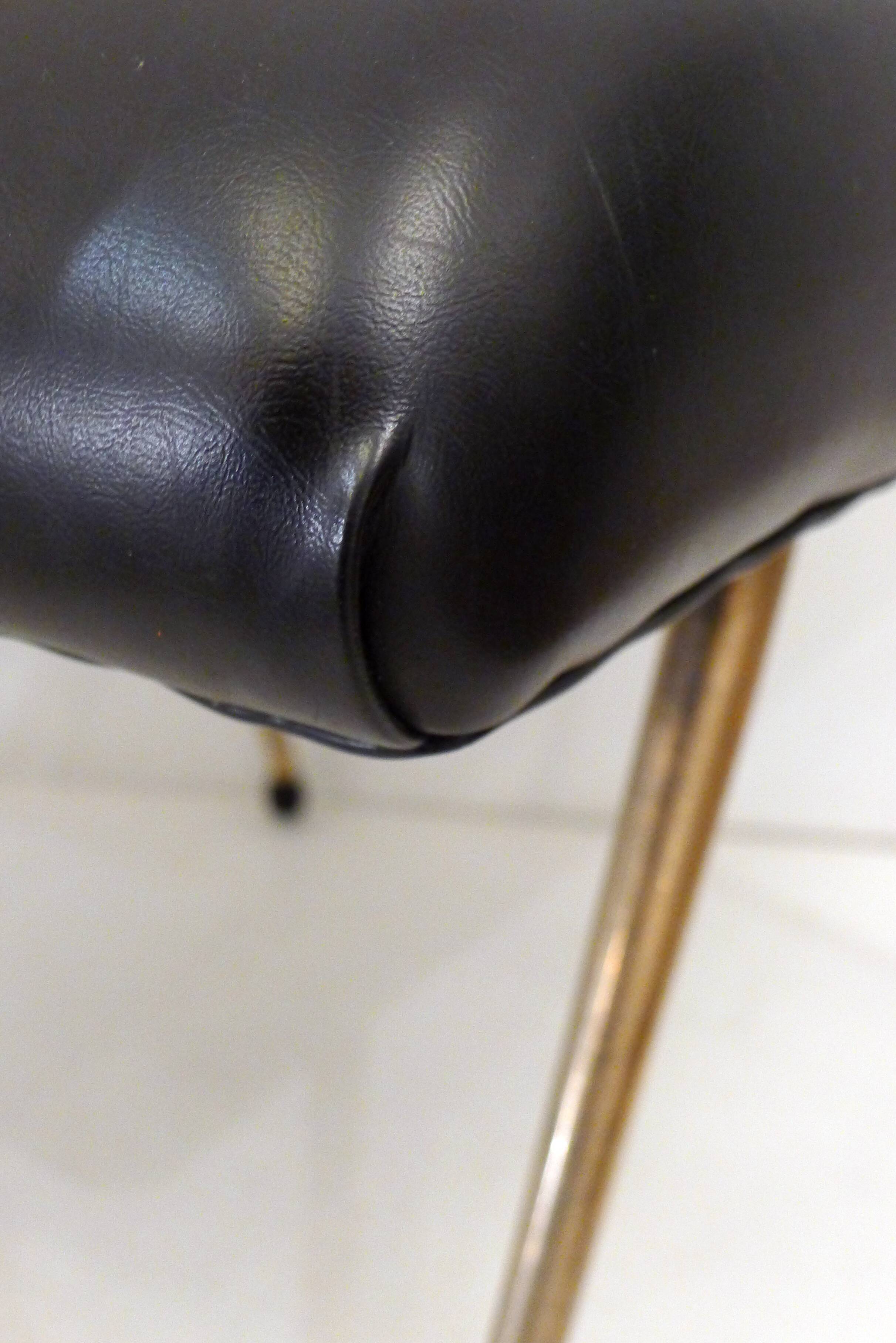 Footrest / stool 1960s with tapered gold legs & faux leather seat