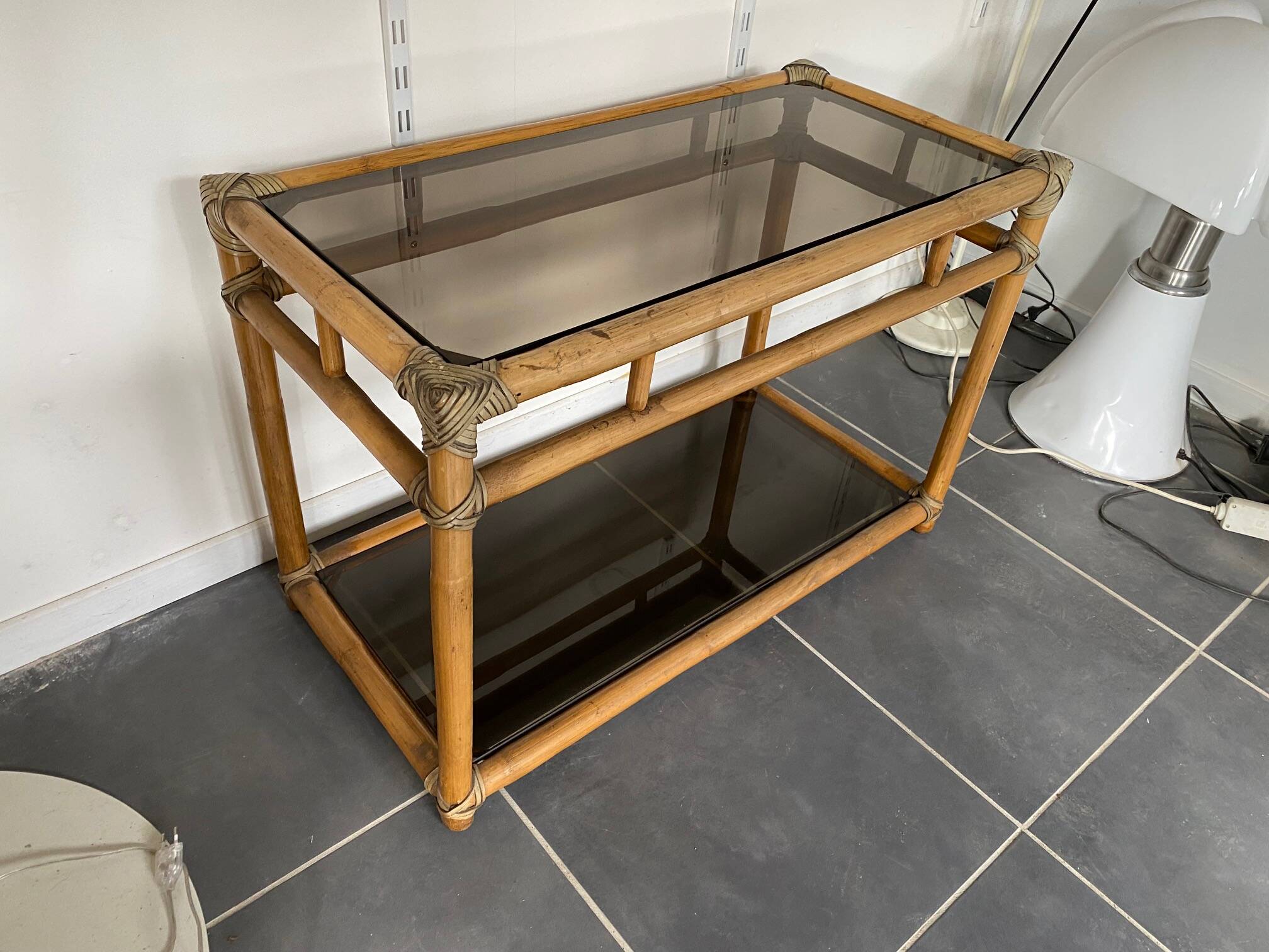 Vintage 1950s rattan and glass TV storage unit.