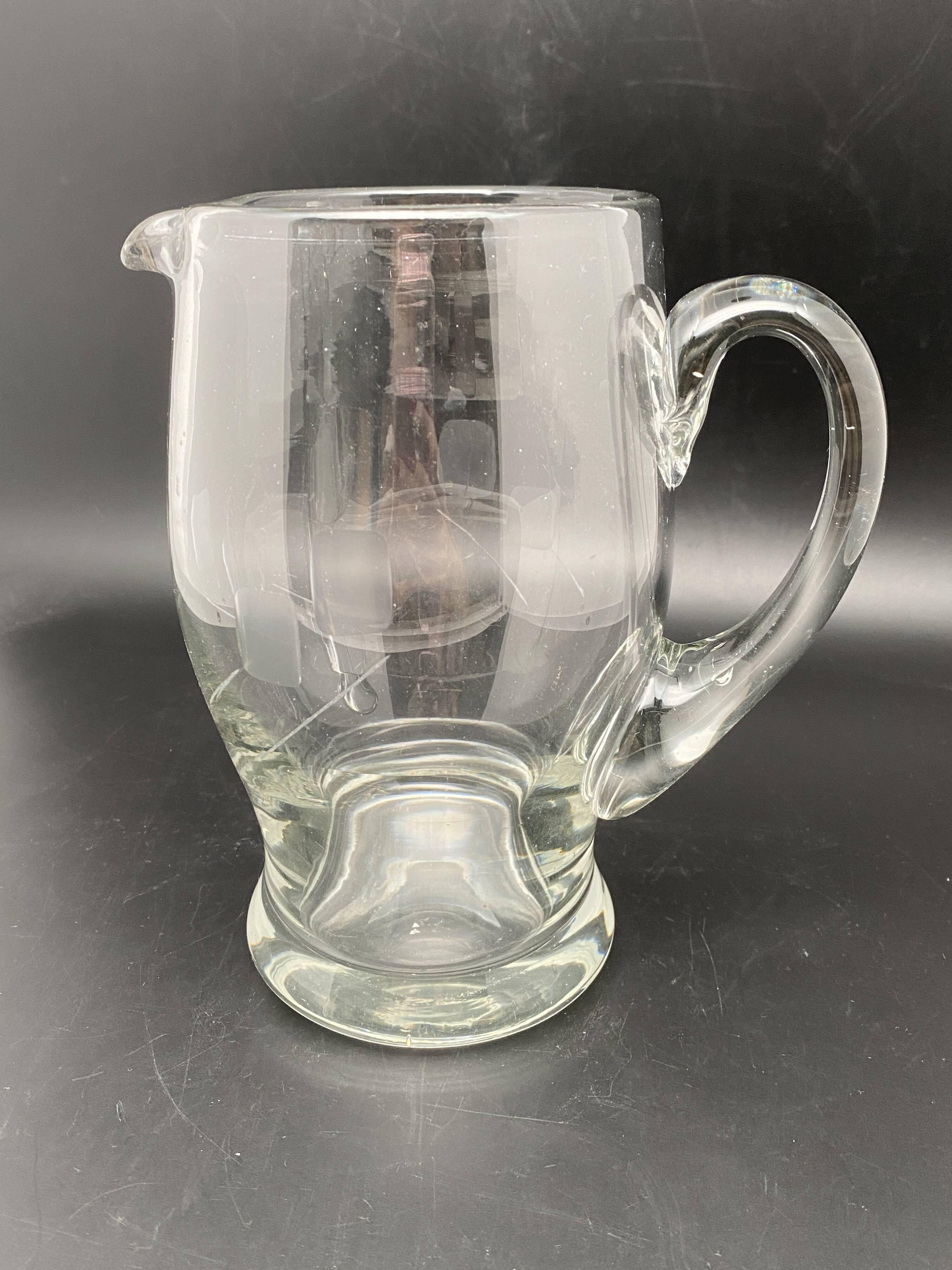 Glass jug with chiseled pattern