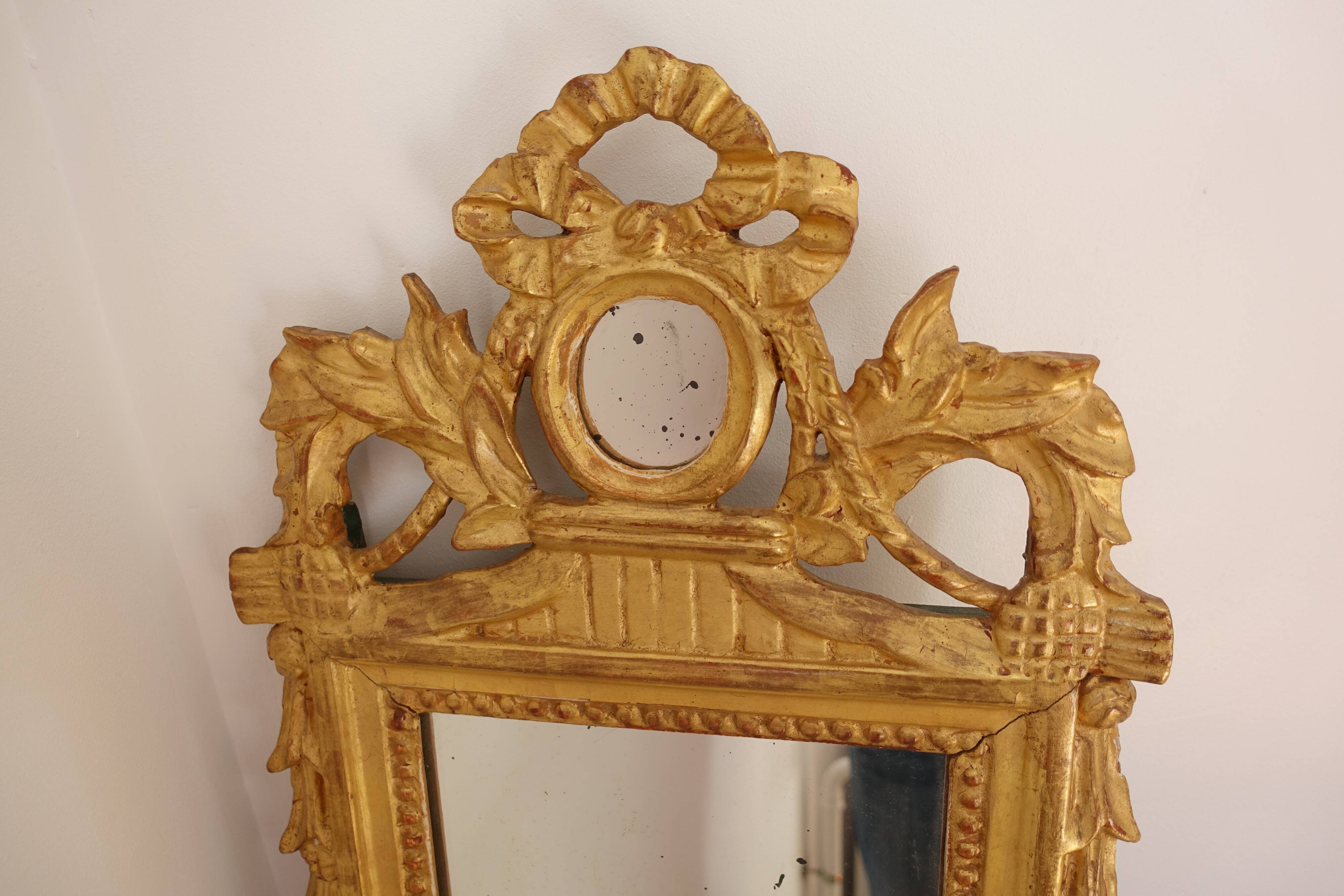 Miroir Louis XVI en bois doré 35x 65cm