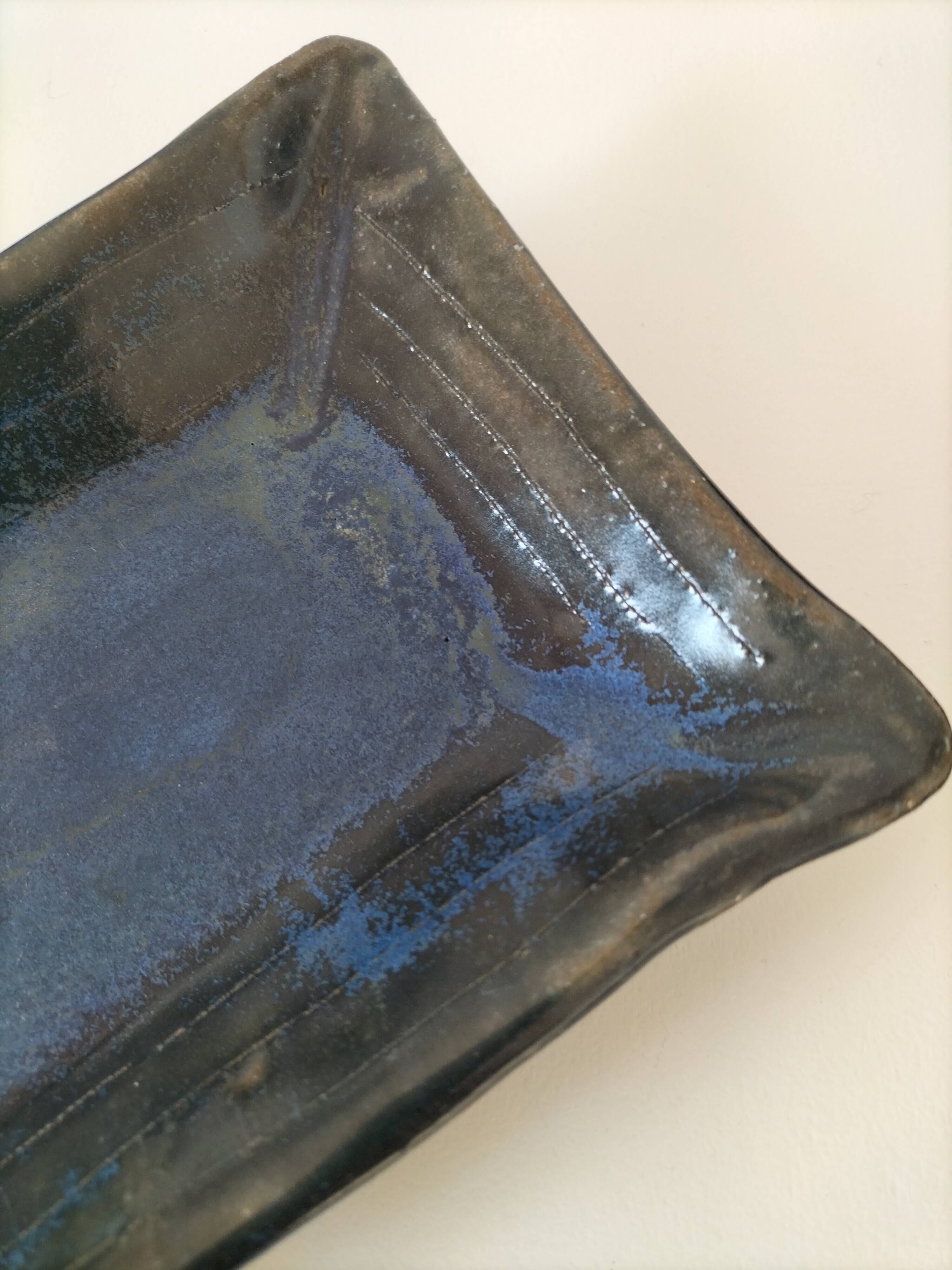 Set of artisanal ceramics in shades of blue.