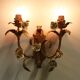Pair of gold wall sconces with porcelain flowers