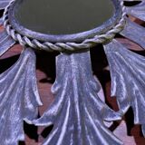 Metal mirror with foliage decoration