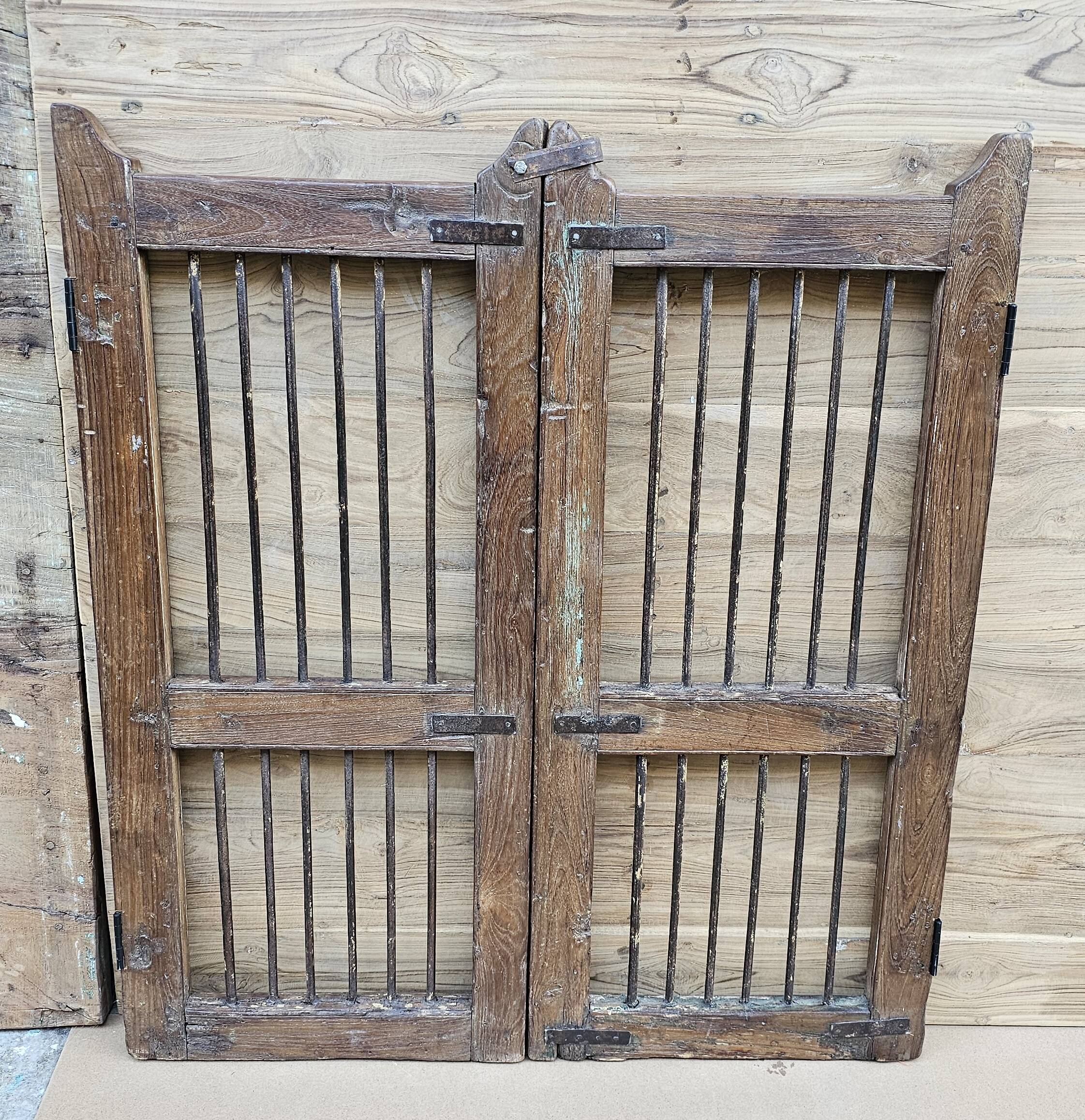 Old gate in Burmese teak and wrought iron