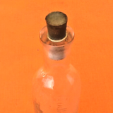 Embossed graduated apothecary bottle 1950's