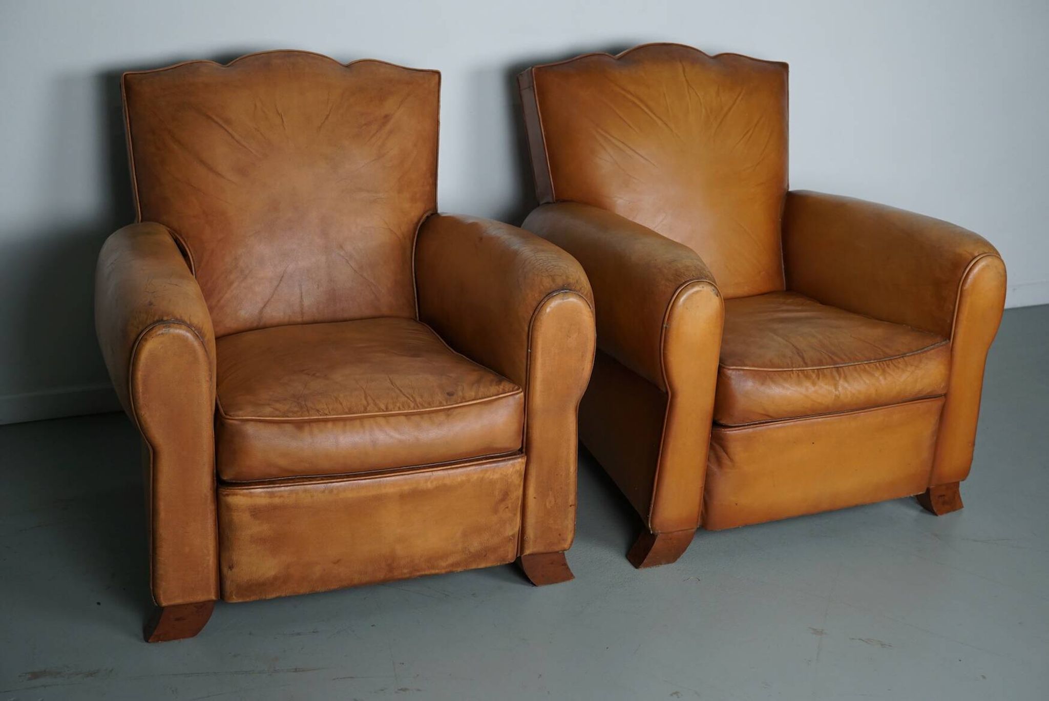 Pair of French Cognac Moustache Back Leather Club Chairs, 1950s