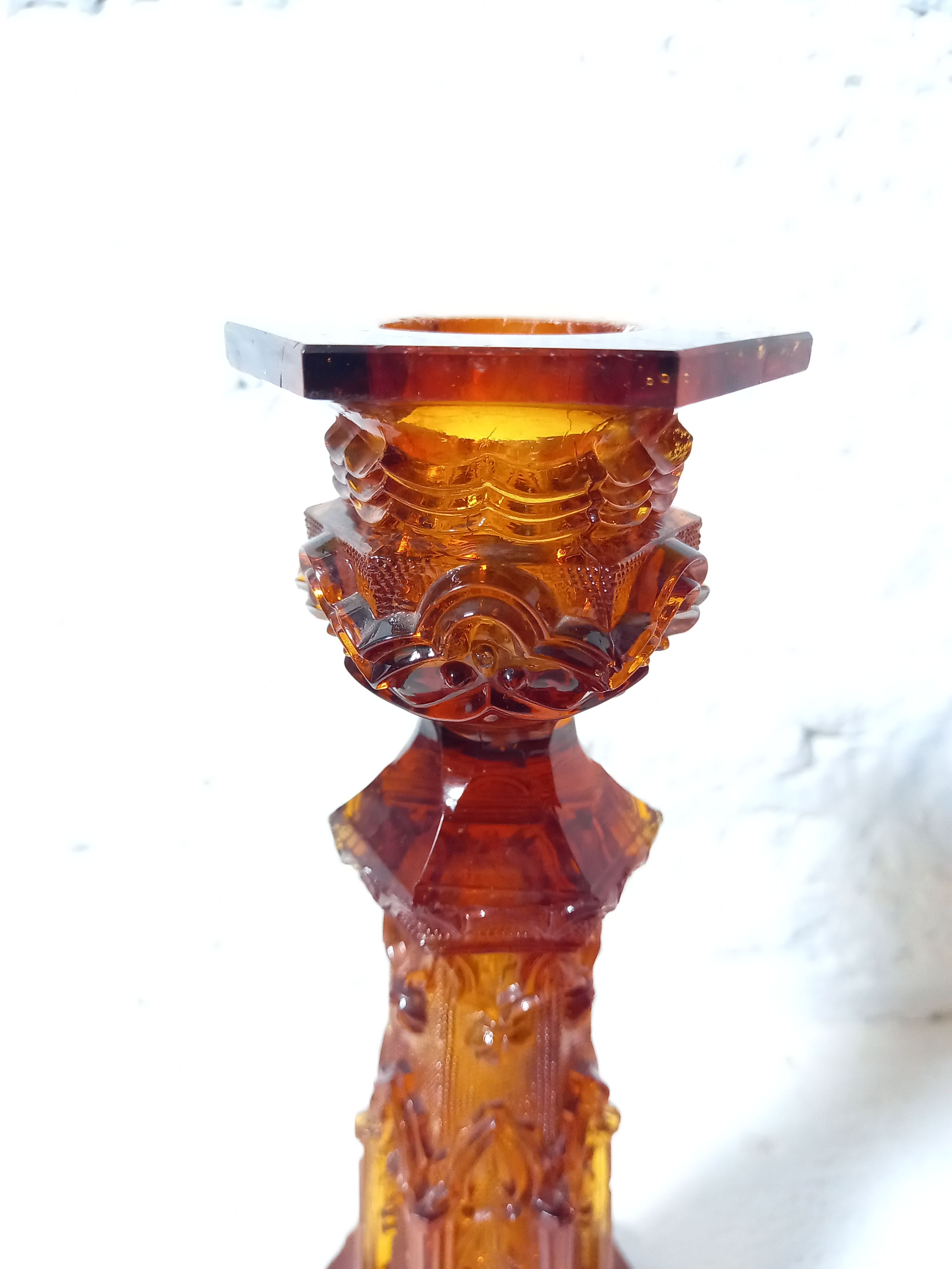Pair of amber glass torches decorated with gothic motifs