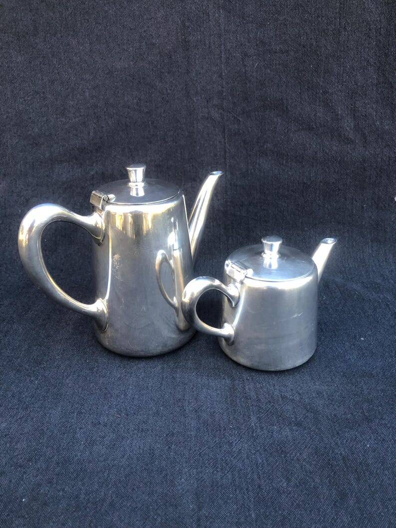 A pair of vintage silver-plated teapot and coffee pot