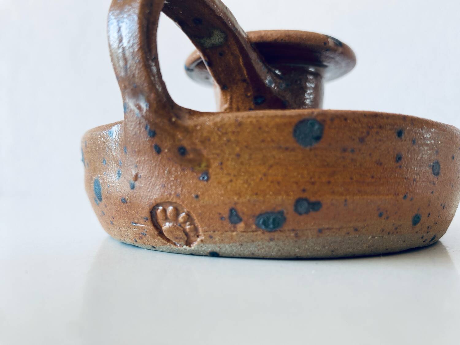 Signed sandstone candle holder