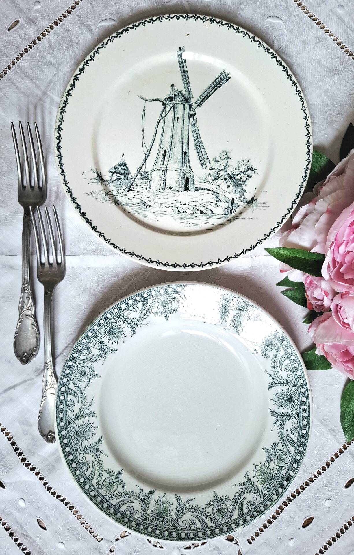 Old mismatched flat plates made of ironstone earthenware.