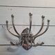 Circular chromed metal coat rack