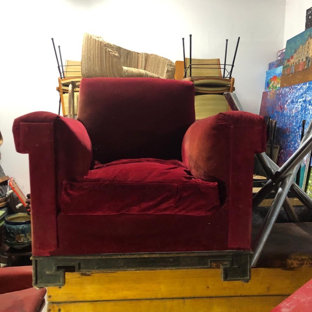 Red armchair with decorated base