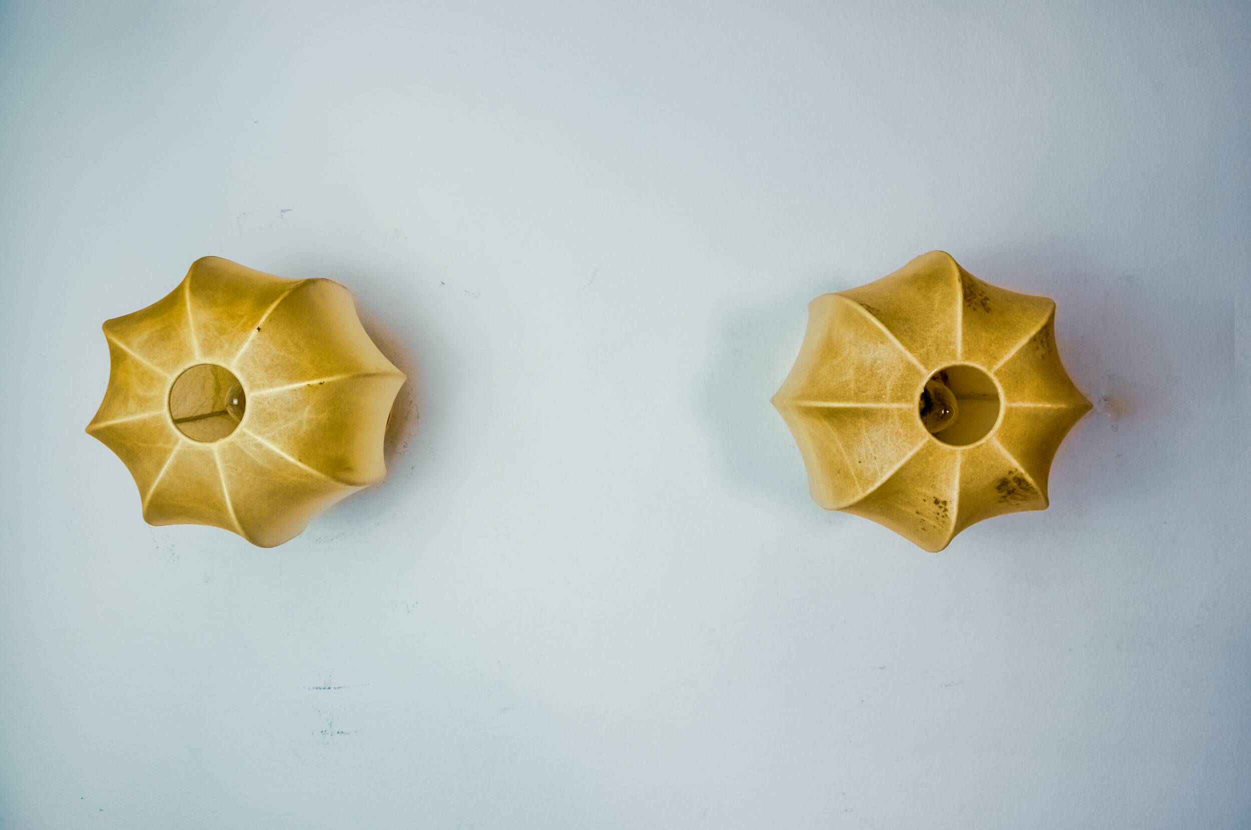 Pair of “cocoon” wall lights, resin and pine, italy, 1970
