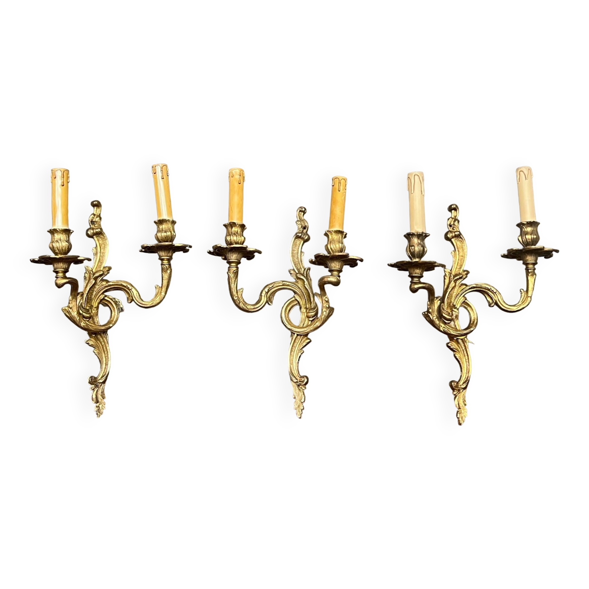 Set of three bronze wall sconces.