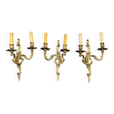 Set of three bronze wall sconces.