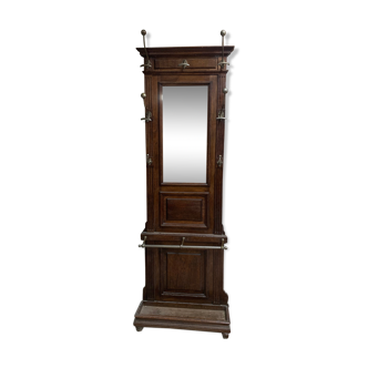 Old wall-mounted mantle-holder cloakroom in see
