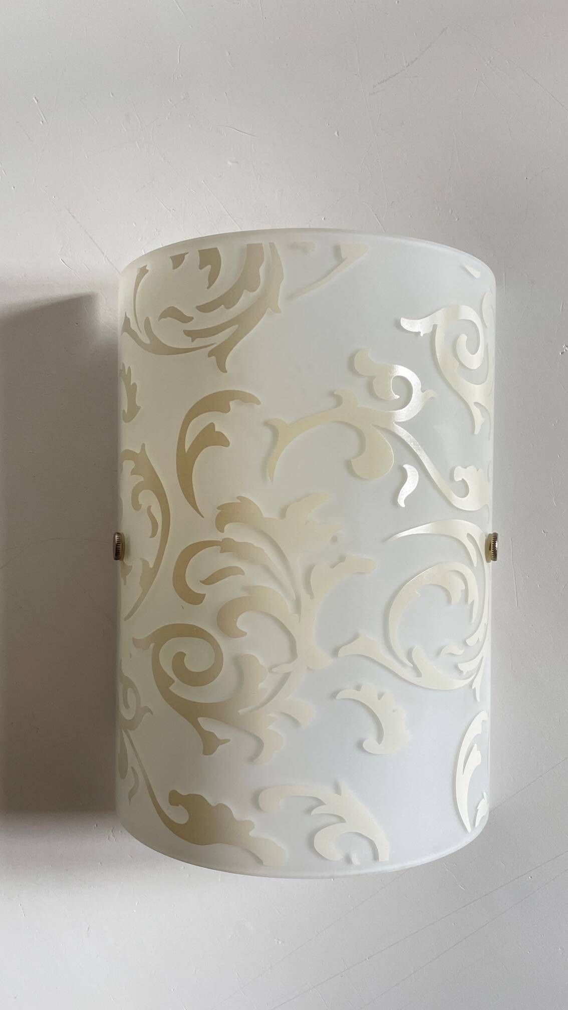 Polished and screen-printed glass sconce by eglo