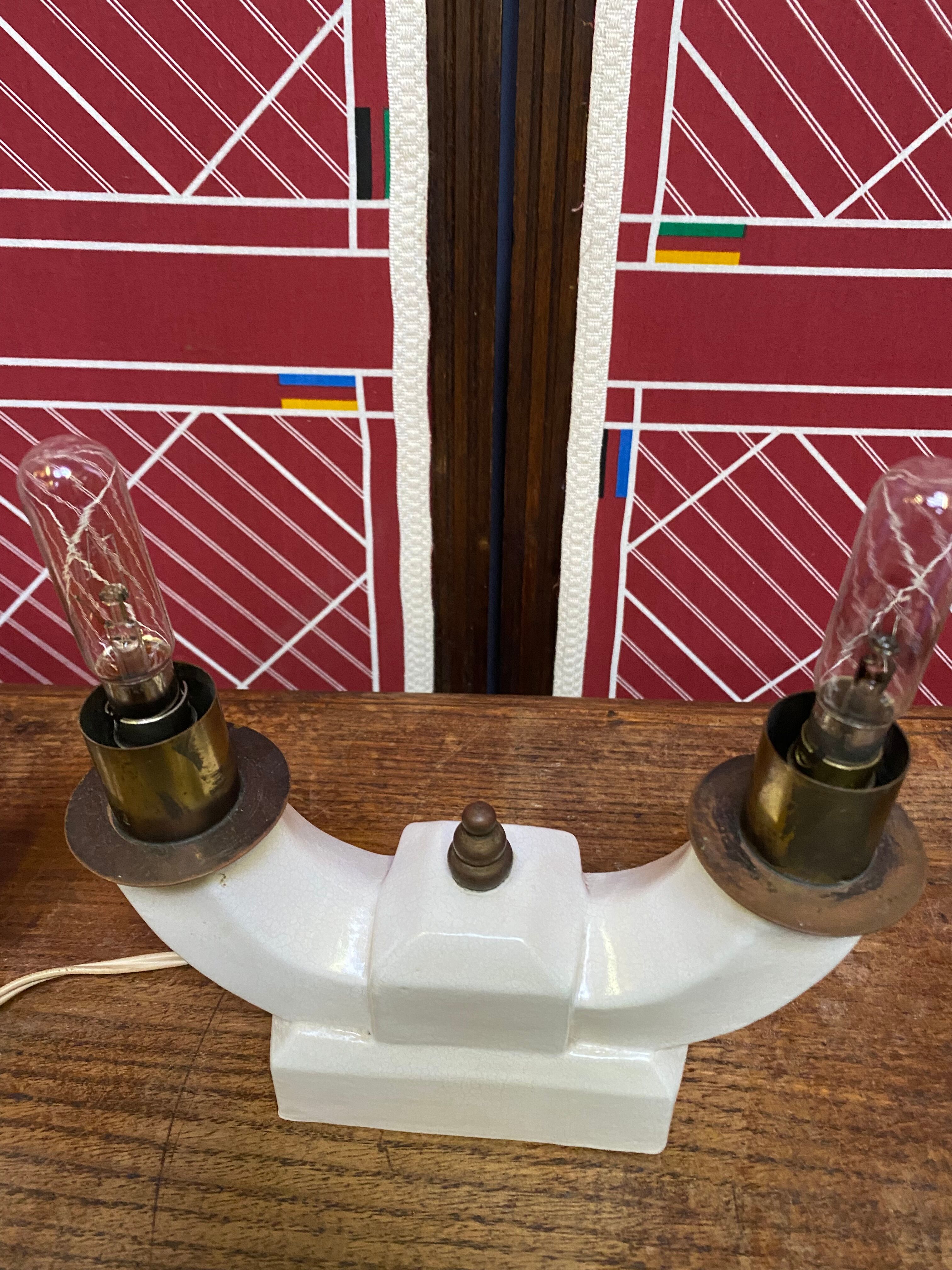 Pair of ceramic and brass office chandeliers