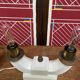 Pair of ceramic and brass office chandeliers