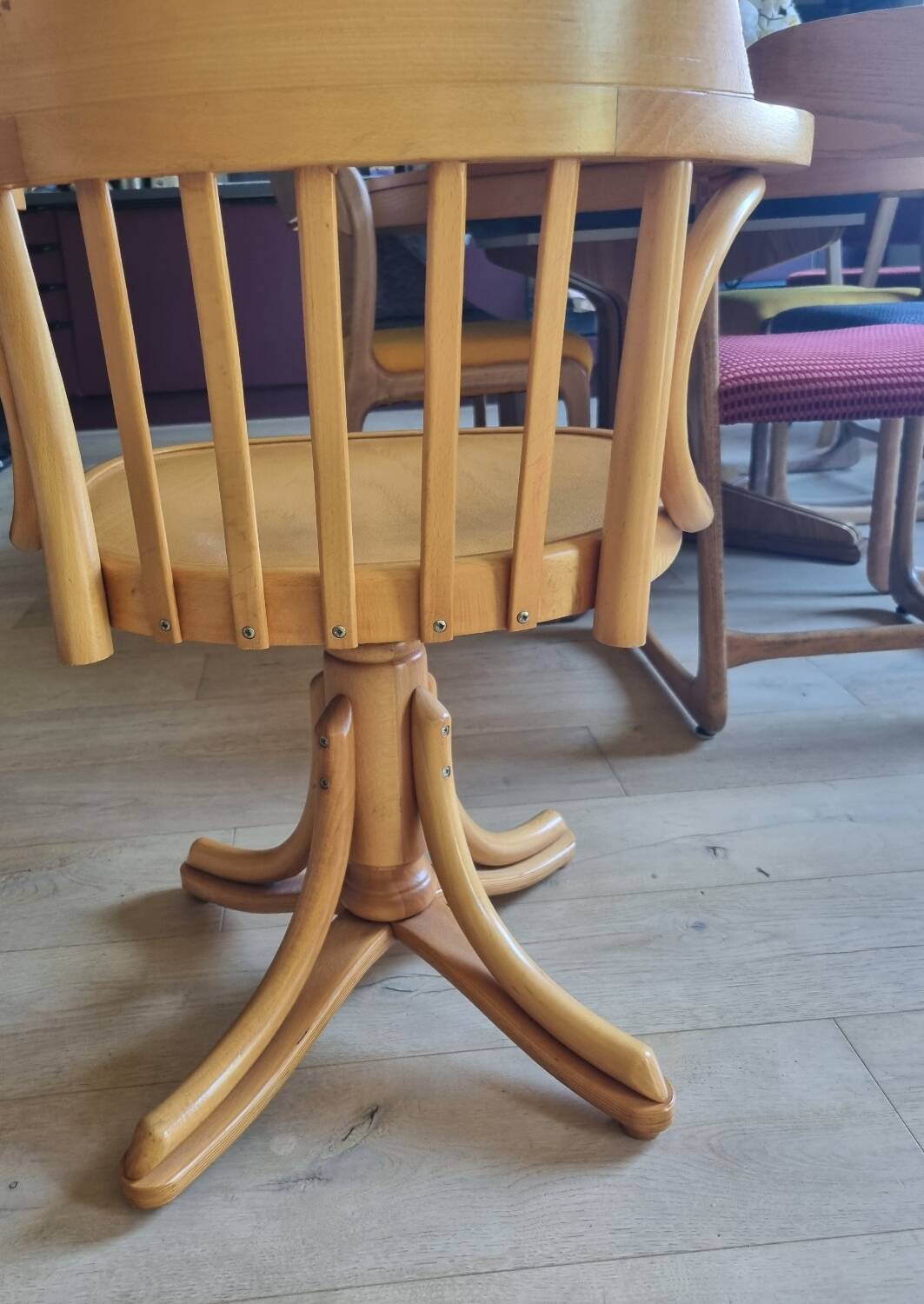 Wooden swivel armchair