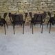 Brown faux leather armchairs