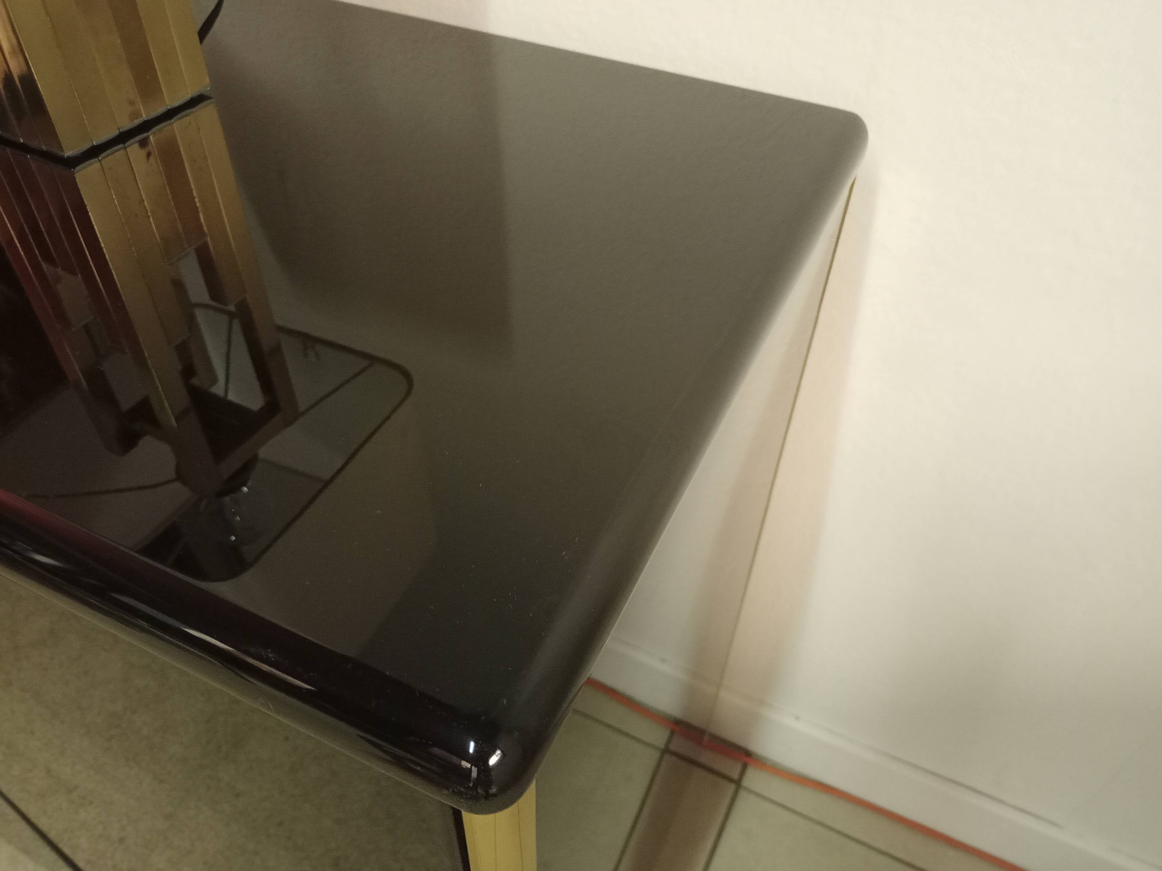 Black lacquered and brass design 70/80