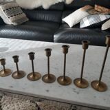 Set of 7 vintage brass candlesticks.