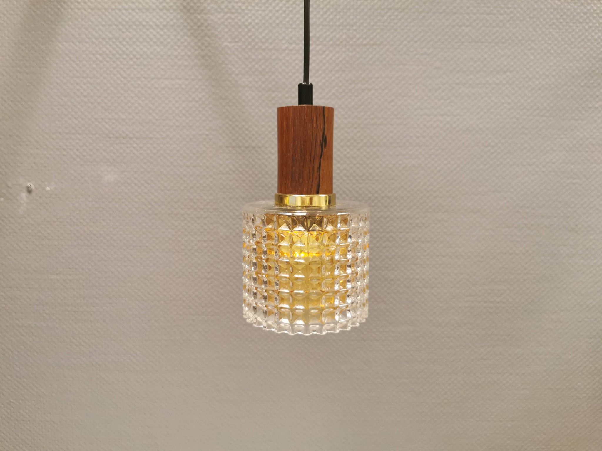 Older Swedish hanging lamp in multi-layered crystal glass with rosewood top and brass ring.